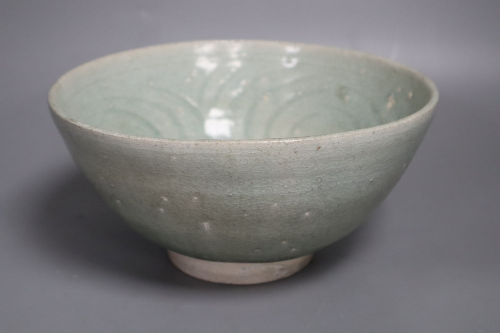 A Thai Sawankhalok celadon glazed bowl, 14th/15th century, 19.5cm diameter